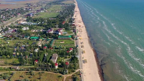Beautiful flight in summer over the beach. People are resting near the sea. Stock Footage 149581275