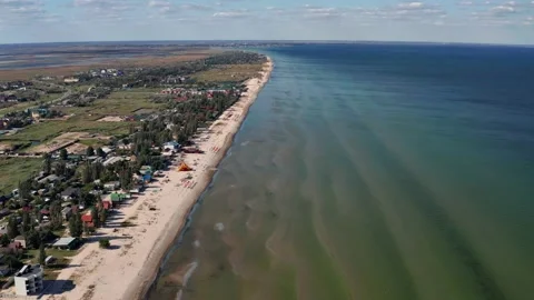 Beautiful flight in summer over the beach. People are resting near the sea. Stock Footage 196818059