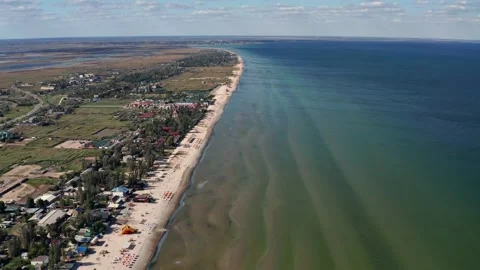 Beautiful flight in summer over the beach. People are resting near the sea. Video stock 200716833