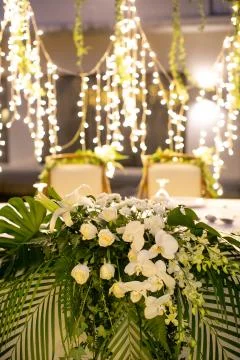 Beautiful flower decoration on a rustic dining table Stock Photos