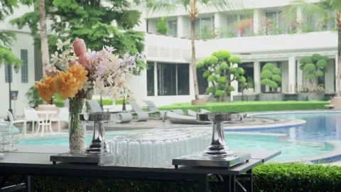 Beautiful flower vases on a buffet table with beverages and food ready for dinne Stock Footage 287857010