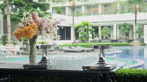 Beautiful flower vases on a buffet table with beverages and food ready for dinne Stock Footage 287857175