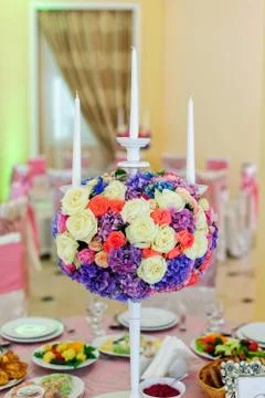 Beautiful flowers with candles Stock Photos