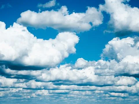 Beautiful, fluffy clouds, floating in the sky on a spring day Stock Photos