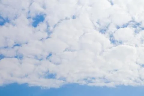 Beautiful fluffy white clouds or Altocumulus in the form Contrail with blue s Stock Photos