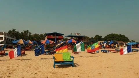 "A BEAUTIFUL FLYING FLAGS: A WAILK AT THE BEACH" Stock Footage 229127863