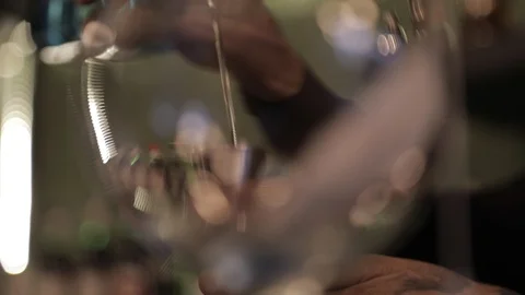Beautiful Focus Bartender Pouring Gin on Glass WIth Jigger Stock Footage 129846434