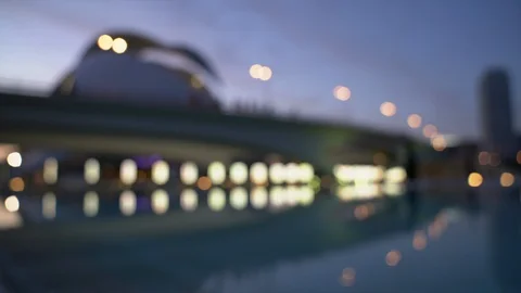 Beautiful focus pull of the flyover at night reflecting on the water of the lake Stock Footage 127895577