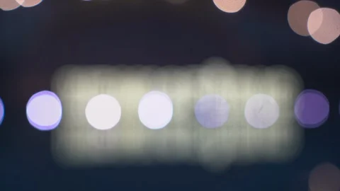 Beautiful focus pull of the Hemispheric sign at night reflecting on the water of Stock Footage 127894674