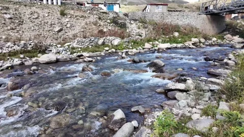 Beautiful Forest River Flowing Rapidly Between Rocky Shores,with Houses Abov Stock Footage 288464865