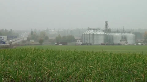 Beautiful form of field of grain elevator Stock Footage 32276036