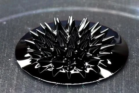 Beautiful forms of ferromagnetic fluid. Iron dissolved in a liqu Stock Photos