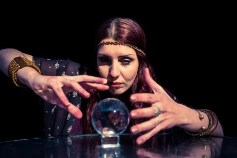 Beautiful fortune teller using crystal ball Fotos de archivo