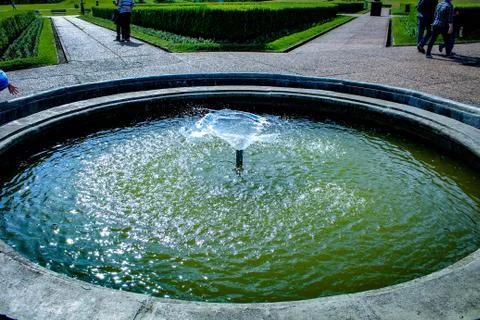 Beautiful fountain on a sunny day Stock Photos