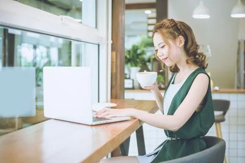 Beautiful Freelancer Woman working online at her home. Stock Photos