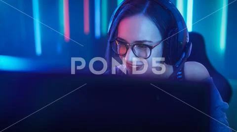 Beautiful Friendly Pro Gamer Girl Does Video Game Gameplay stream Stock Photos