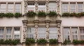 Beautiful Front Facade German Architecture Building Red Flowers Windows Munich HD Footage