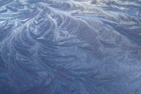 Beautiful frosty pattern an equal surface in winter morning. Stock Photos