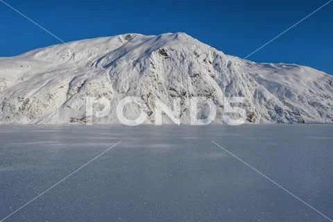Beautiful frozen Portage Lake in mid-winter in South-central Alaska Stock Photos