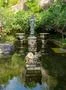 Beautiful garden statue with pond in Bali Indonesia at sunny day Photo