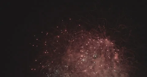Beautiful general shot of the sky at night when fireworks explode with red Stock Footage 265984528