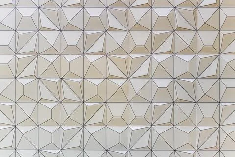 Beautiful geometric pattern design of mosaic on the wall background Stock Photos