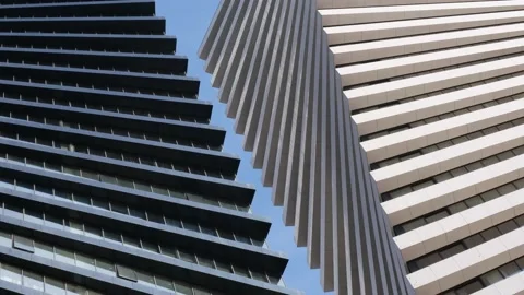 Beautiful geometric shape of two high-rise buildings side by side. Image ro.. Stock Footage 233700384