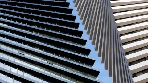 A beautiful geometric shape of two high-rise office buildings located side .. Stock Footage 234683972