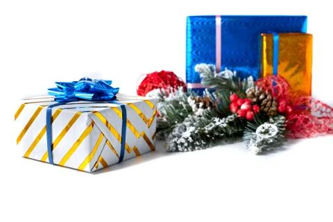 Beautiful gift boxes and Christmas decoration on a white background. Stock Photos