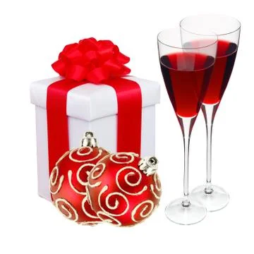 Beautiful gift in white packaging, two wineglass and red christmas balls isol Stockfoto's
