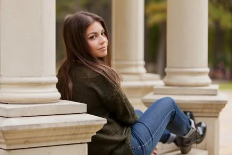The beautiful girl on an arbour handrail Stock Photos