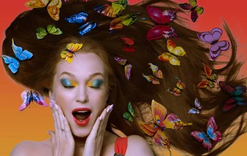 Beautiful girl in bright makeup with long hair decorated with butterflies Stock Photos
