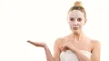 The beautiful girl with a clean face mask gesturing on the white background 4k or 4k+ Resolution
