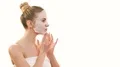 The beautiful girl with a clean mask touching the face on the white background 4k or 4k+ Resolution