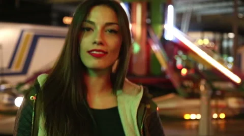 Beautiful girl dancing in amusement park Stock Footage 59556181