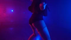 Attractive girl in sexy outfit standing ... | Stock Video | Pond5