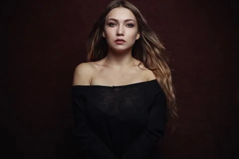 Beautiful girl on a dark background Stock Photos
