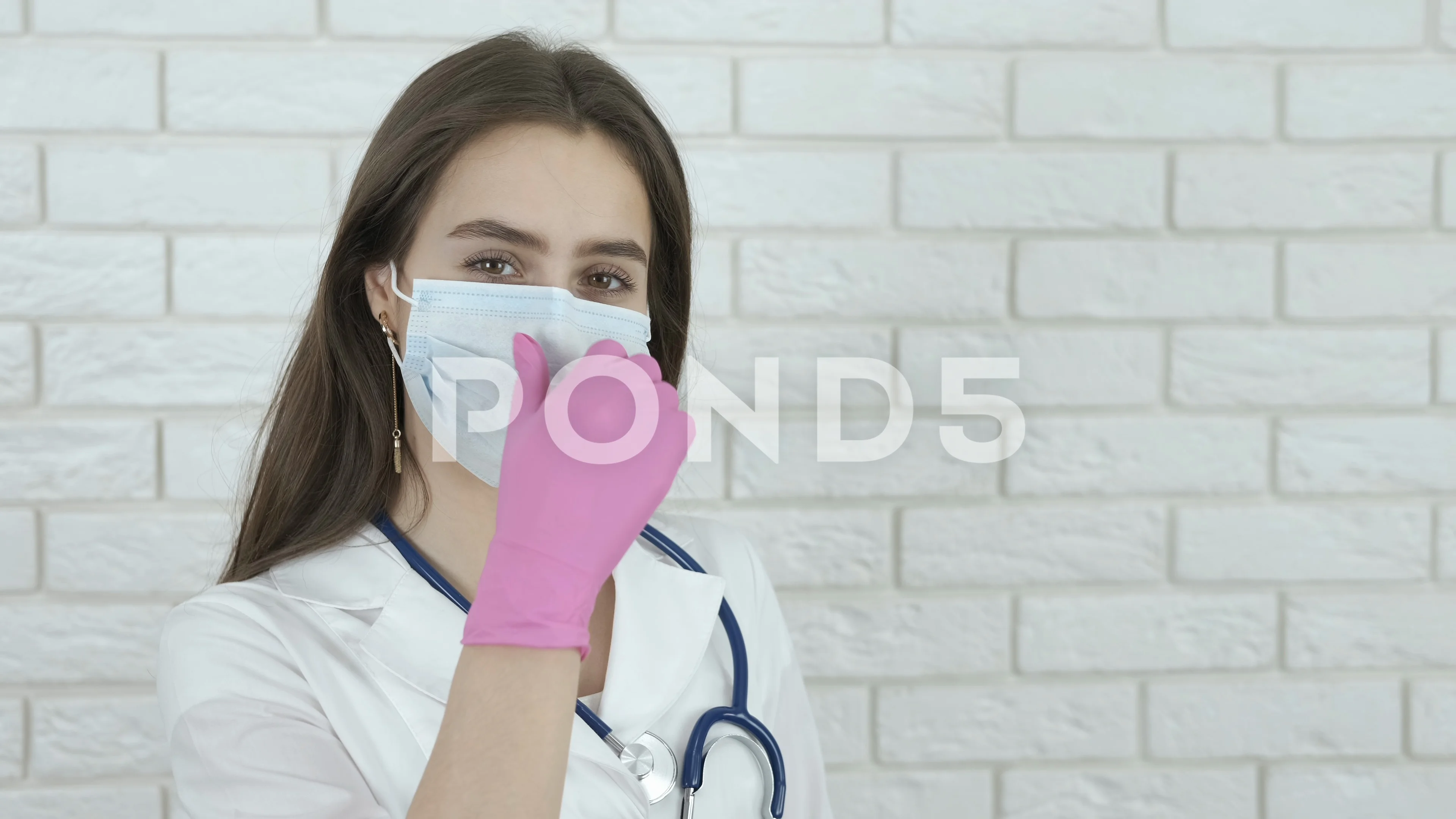 Beautiful young girl shopaholic in medical face mask and