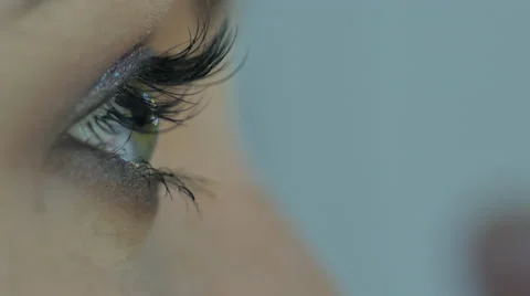 Beautiful girl doing makeup Stock Footage