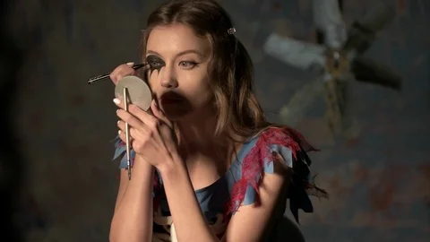 Beautiful girl doing makeup before the holiday halloween Stock Footage 81252053