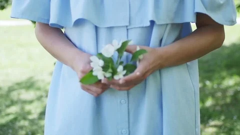 Beautiful girl in a dress with a apple at the apple tree Stock Footage