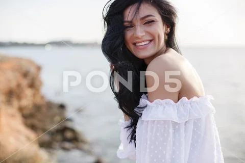 Beautiful girl in a dress on the beach, fashion woman, sea, sunny island Stock Photos