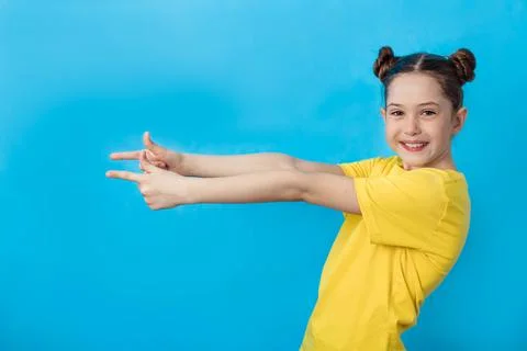 Beautiful girl dressed in a yellow basic casual t-shirt Stock Photos