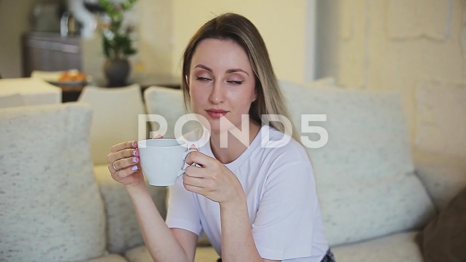 Beautiful girl drinking hot drink