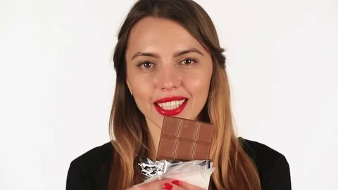 Beautiful girl eats chocolate Stock Footage 71002757