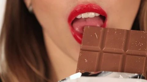 Beautiful girl eats chocolate Stock Footage 71002812