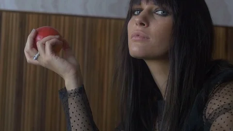 Beautiful girl eats red apple Видео 72960562