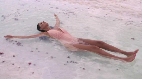 Beautiful girl floating in the Dead Sea. Stock Footage 68771253