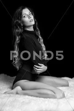 Beautiful girl on furs Stock Photos