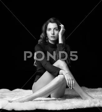 Beautiful girl on furs Stock Photos